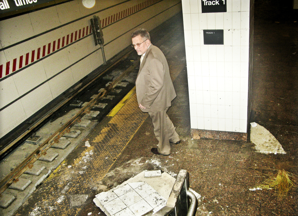 Joseph Leader, chief maintenance officer of the New York City subway system, surveys damage caused by Superstorm Sandy, this week at the South Ferry station.