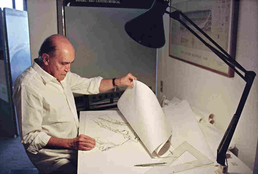 Brazilian architect Oscar Niemeyer looks at drawings for a project of two cities in Senegal, Africa, in his office in Rio de Janeiro, 1992. Brazilian architect Oscar Niemeyer looks at drawings for a project of two cities in Senegal, Africa, in his office in Rio de Janeiro, 1992.
