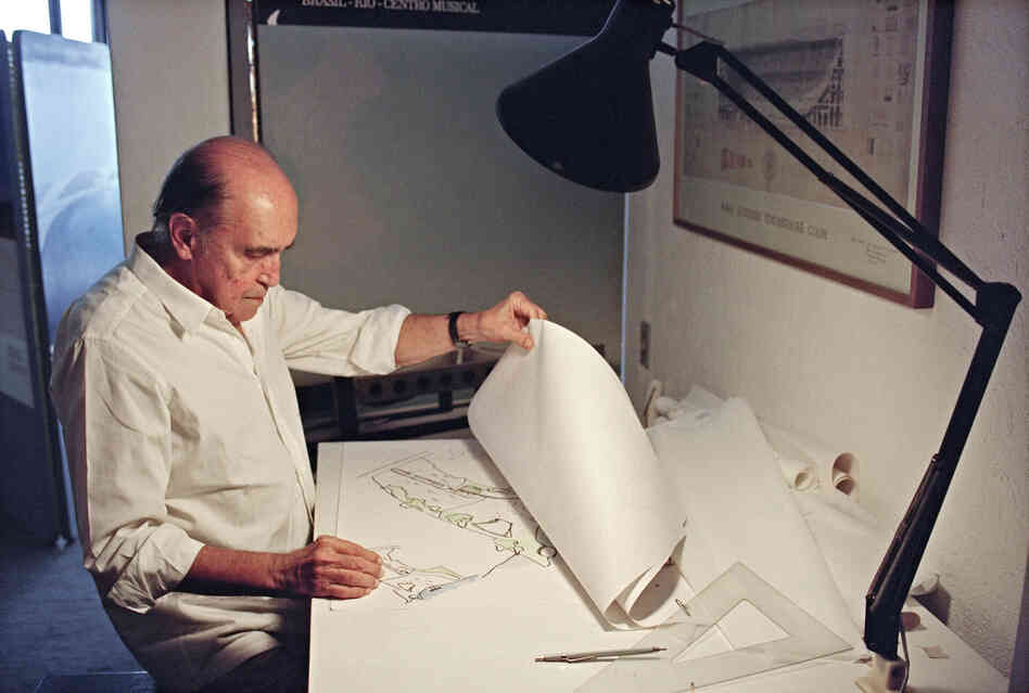 Brazilian architect Oscar Niemeyer looks at drawings for a project of two cities in Senegal, Africa, in his office in Rio de Janeiro, 1992. Brazilian architect Oscar Niemeyer looks at drawings for a project of two cities in Senegal, Africa, in his office in Rio de Janeiro, 1992.