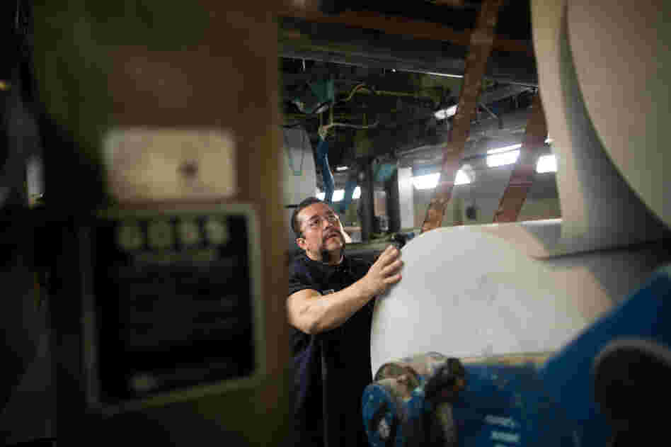 Jerry Ascencio, a pressman at The Orange County Register, works in the basement of the presses.