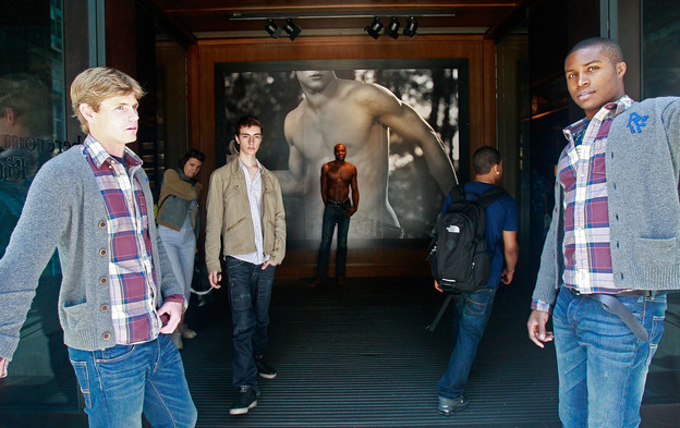 A model at the front entrance to the Abercrombie & Fitch flagship store in New York City.