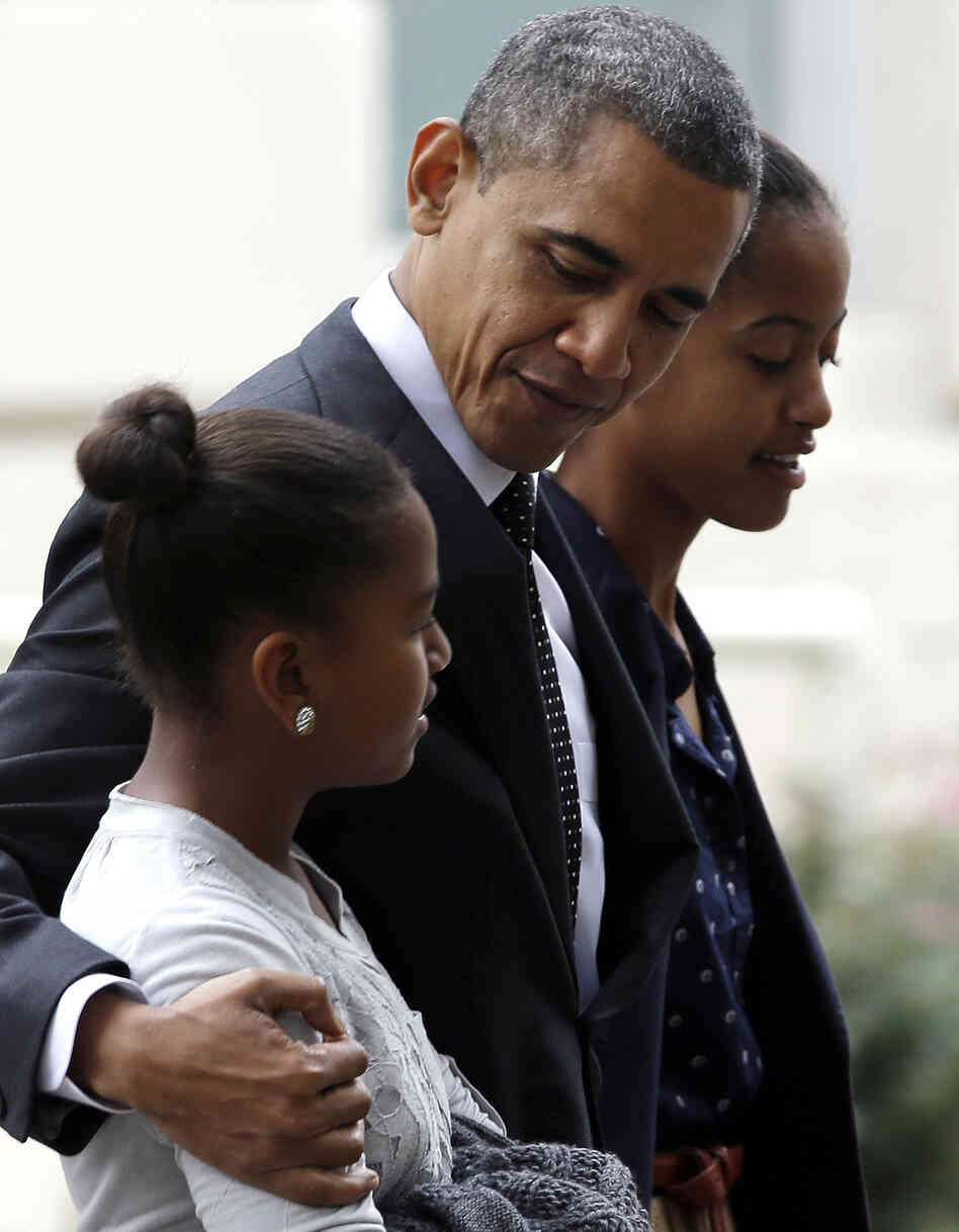 President Obama walks with his daughters Sasha, foreground, and Malia as they leave St. John's Episcopal Church in Washington, on Oct. 28. An analysis of exit polls shows that those who claim no specific religious affiliation were a key Obama voting bloc in the presidential race.