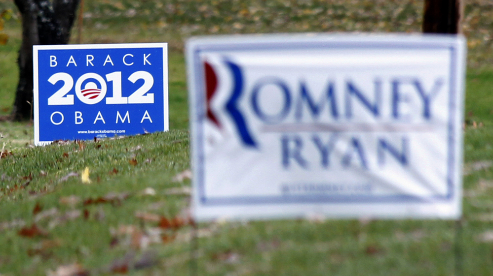 Competing yard signs near Evans City, Pa., four days before the election. The campaigns of President Obama and Republican Mitt Romney each raised more than $1 billion during the race.