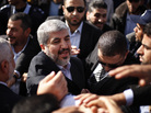 The exiled Hamas chief Khaled Mashaal shakes hands with supporters upon his arrival at Rafah crossing in the southern Gaza Strip. The exiled Hamas chief Khaled Mashaal shakes hands with supporters upon his arrival at Rafah crossing in the southern Gaza Strip.