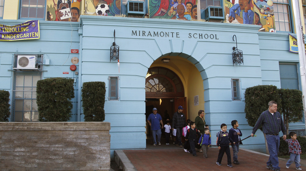 In this Jan. 31, 2012 file photo, students leave Miramonte Elementary, in the Clovis Unified School District in Los Angeles. School districts across California have taken out loans requiring payments that far exceed the original loan amounts.
