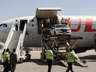 Syrian rebels say they now consider the Damascus International Airport to be part of the battle zone in their fight against Syria's government. Here, a U.N. vehicle is unloaded at the airport on May 12. Syrian rebels say they now consider the Damascus International Airport to be part of the battle zone in their fight against Syria's government. Here, a U.N. vehicle is unloaded at the airport on May 12.