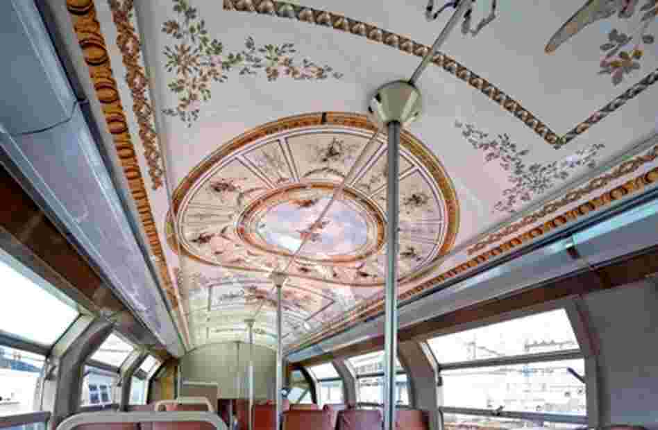 Each train's seven cars are decorated using sticker-like coverings made of a plastified film to reflect rooms or areas of Versailles.