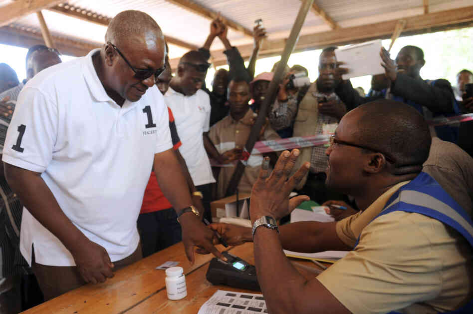 Ghana's President John Dramani Mahama arrives at a polling station to cast his vote.