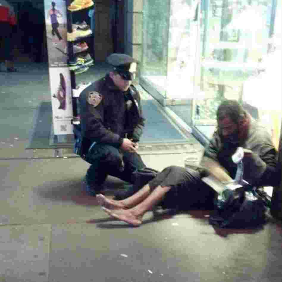 The photo that touched many hearts: New York City Police Officer Lawrence DePrimo gives a shoeless man a pair of boots on a frigid night last month. The photo that touched many hearts: New York City Police Officer Lawrence DePrimo gives a shoeless man a pair of boots on a frigid night last month.