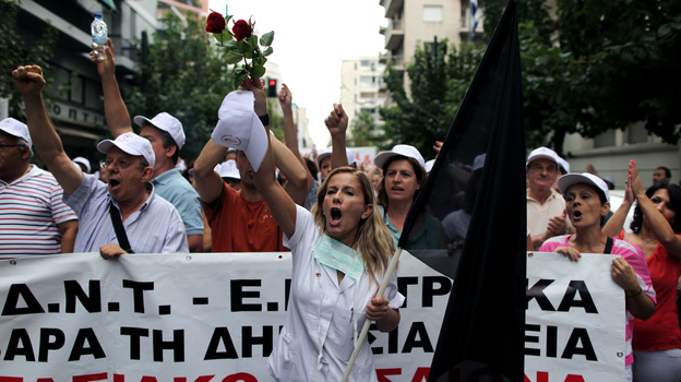 Public hospital workers protest outside the Health Ministry in central Athens in October. Hospital budgets have been slashed by more than half.