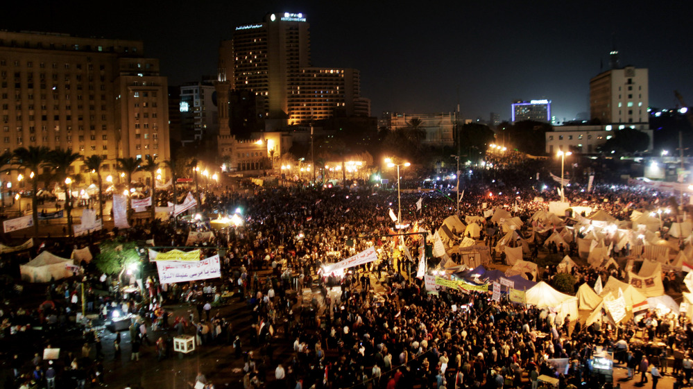 Protesters gather in Tahrir Square in Cairo, Egypt, on Tuesday. Tens of thousands of Egyptians also gathered outside the presidential palace in Cairo in demonstrations that turned violent as tensions grew over President Mohammed Morsi's seizure of nearly unrestricted powers.