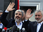 Exiled Hamas chief Khaled Mashaal (left) and Gaza's Hamas Prime Minister Ismail Haniyeh wave during a news conference upon Meshaal's arrival at Rafah crossing in the southern Gaza Strip on Friday. Exiled Hamas chief Khaled Mashaal (left) and Gaza's Hamas Prime Minister Ismail Haniyeh wave during a news conference upon Meshaal's arrival at Rafah crossing in the southern Gaza Strip on Friday.