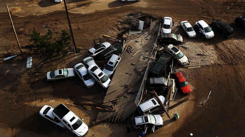 Abandoned and flooded cars sit in the Rockaway neighborhood of Queens, N.Y., on Nov. 2. It's estimated that it could cost auto insurers $800 million to deal with all the claims from the storm.