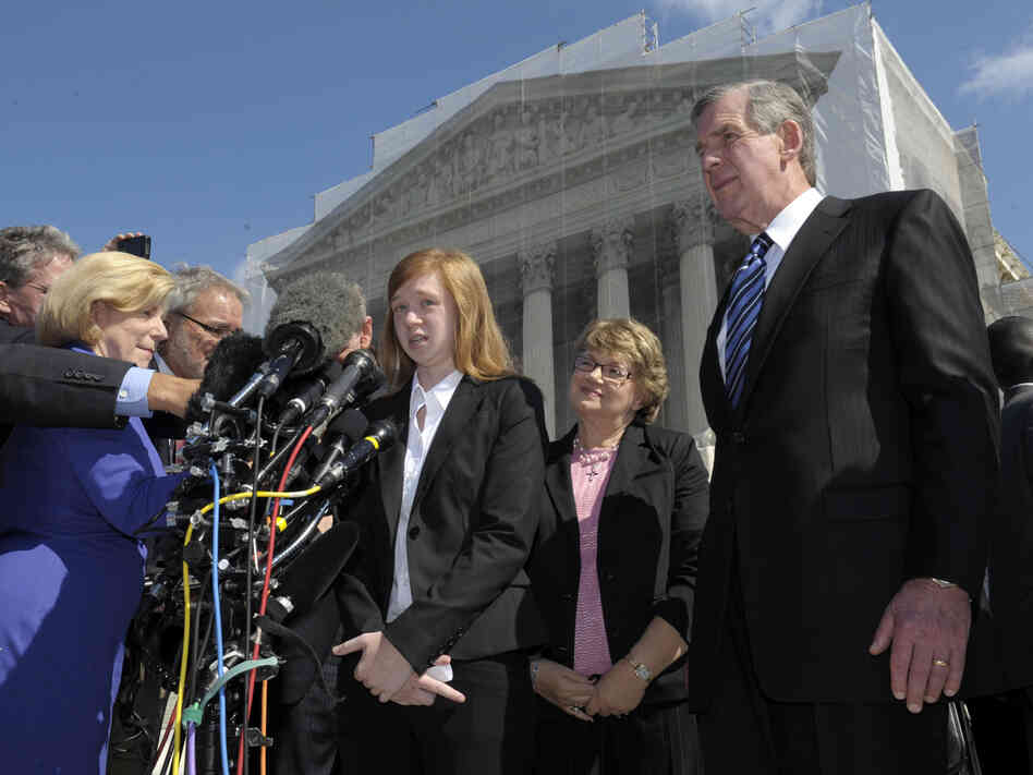 Abigail Fisher, the Texan involved in the University of Texas affirmative action case, accompanied by her attorney Bert Rein, right, talks to reporters outside the Supreme Court in October.