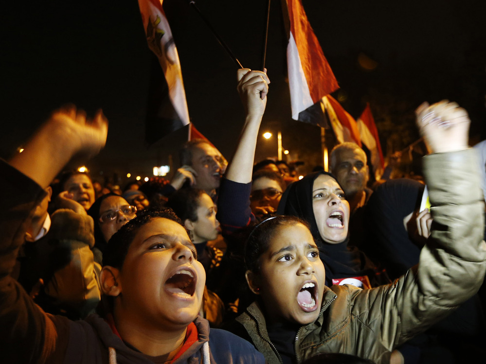 Protesters chant slogans during a demonstration in front of the presidential palace in Cairo, Egypt, on Sunday.