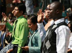 Nearly 50 immigrants took the U.S. naturalization oath at the Baltimore harbor on Sept. 22. Nearly 50 immigrants took the U.S. naturalization oath at the Baltimore harbor on Sept. 22.