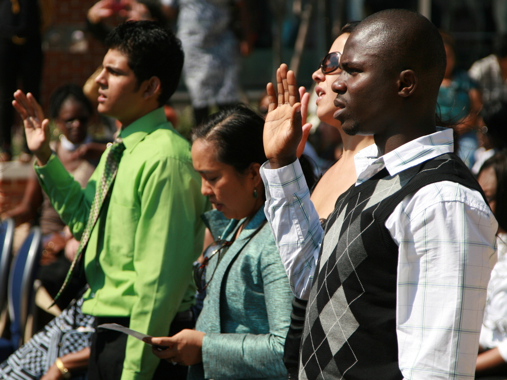 Nearly 50 immigrants took the U.S. naturalization oath at the Baltimore harbor on Sept. 22. Nearly 50 immigrants took the U.S. naturalization oath at the Baltimore harbor on Sept. 22.