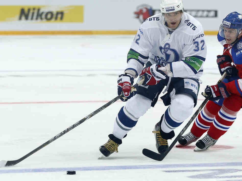 Erik Christensen, right, from Lev Praha challenges Alexander Ovechkin from Dynamo Moscow during their KHL ice hockey match in Prague, Czech Republic, Tuesday, Oct. 9. Ovechkin is among those NHL players who were signed by European clubs because of the NHL lockout.