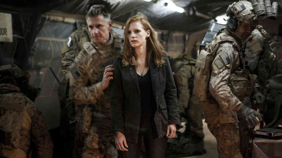Stationed at a covert base overseas, Maya (Jessica Chastain) is a member of the elite team of spies and military operatives (Christopher Stanley, left, and Alex Corbet Burcher, right) who devote themselves to finding Osama bin Laden. Stationed at a covert base overseas, Maya (Jessica Chastain) is a member of the elite team of spies and military operatives (Christopher Stanley, left, and Alex Corbet Burcher, right) who devote themselves to finding Osama bin Laden.