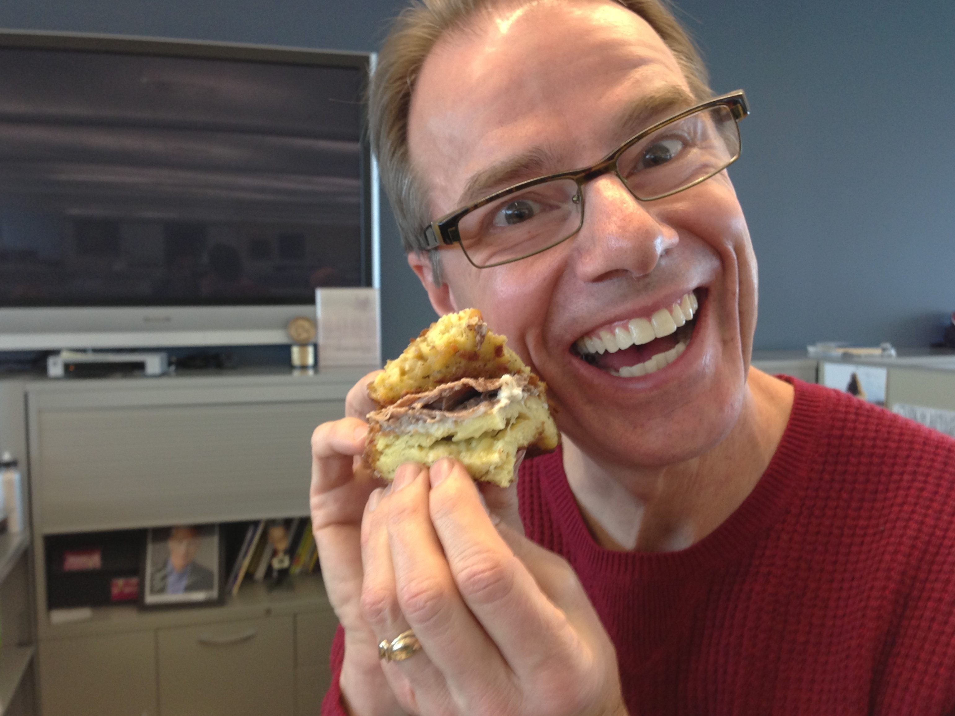 Robert befriends the sandwich before eating it.