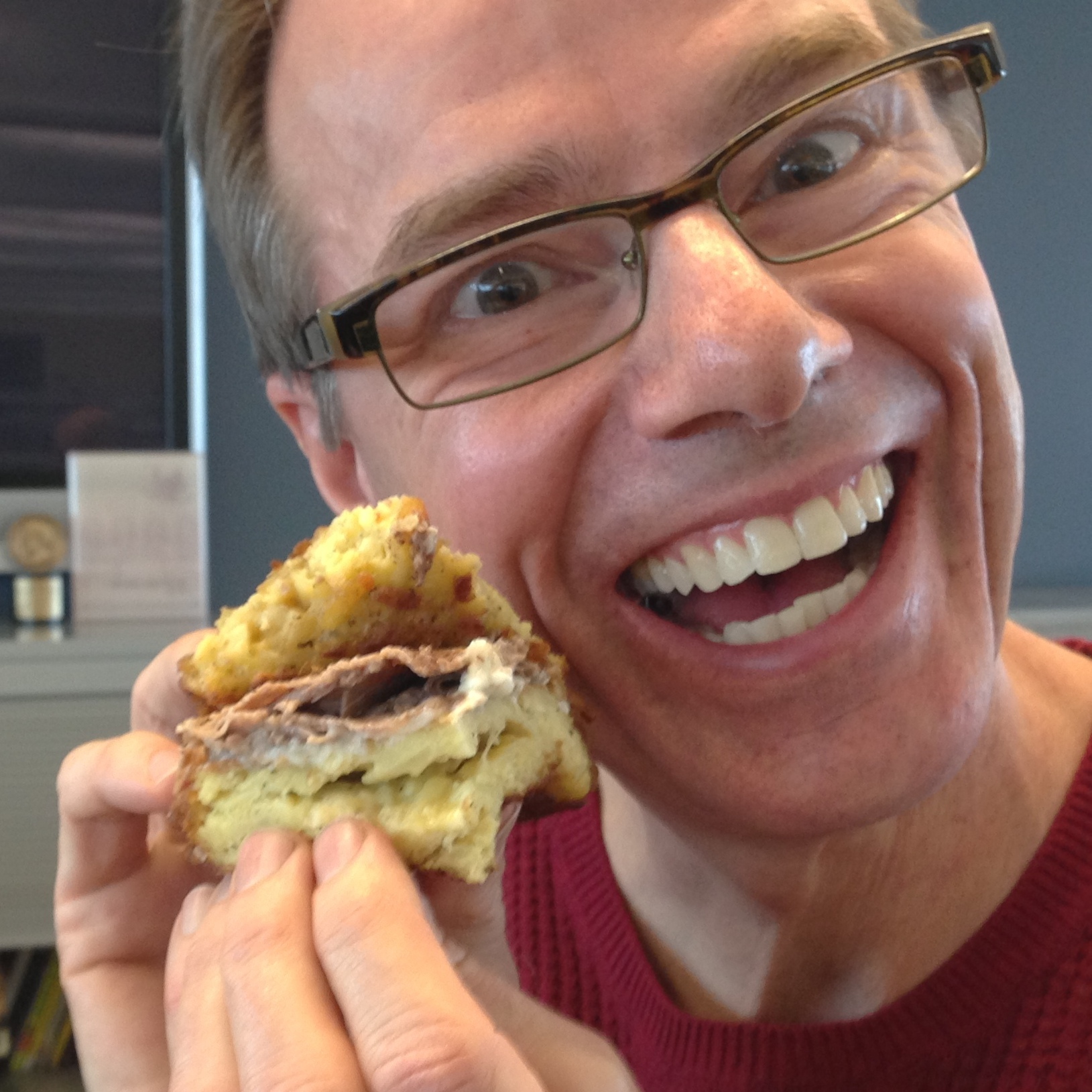 Robert befriends the sandwich before eating it.