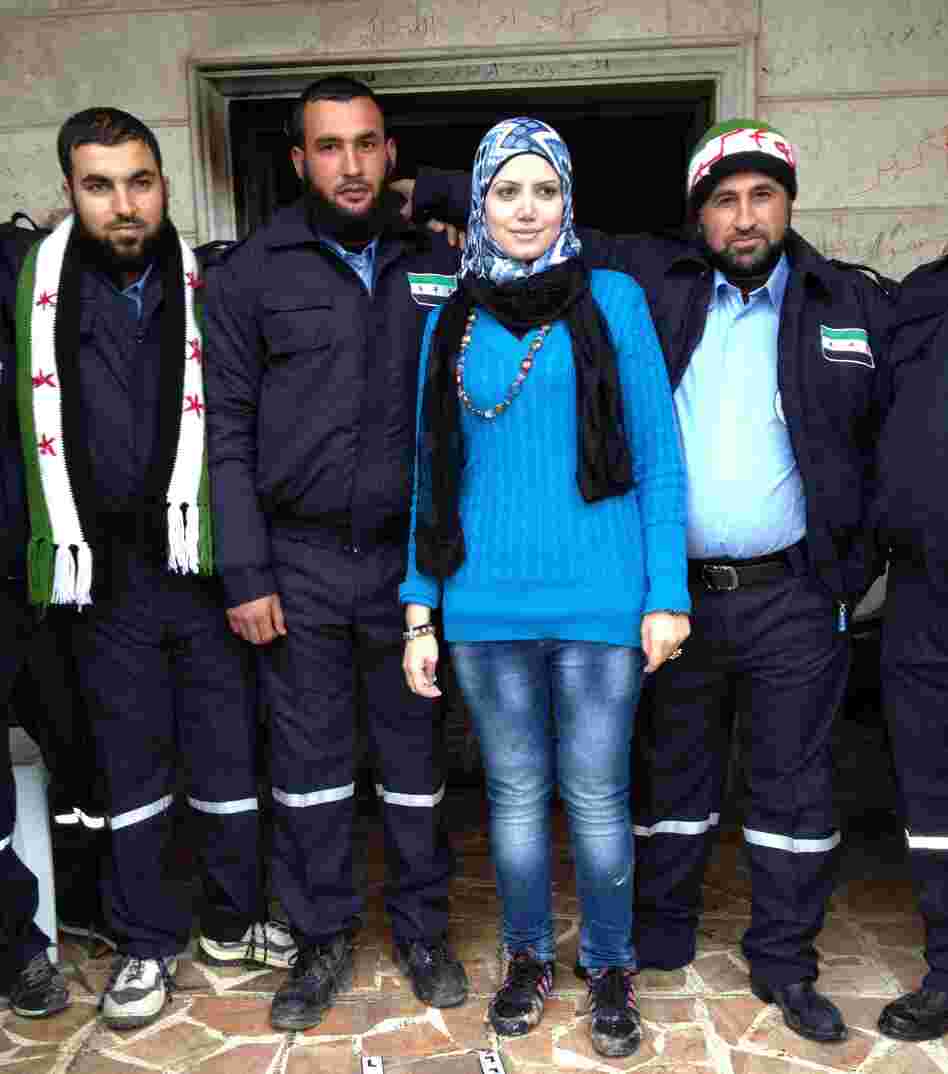 Razan Shalab Alsham, in bright blue, works for the Syrian Emergency Task Force. She helped provide uniforms for the  new civil police force of Khirbet al-Joz.