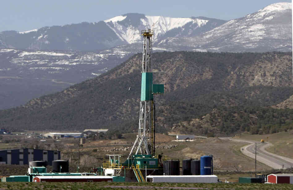 FILE - In this April 22, 2008 file photo, a natural gas well pad sits in front of the Roan Plateau near Rifle, Co. The director of the Colorado Oil and Gas Conservation Commission, David Neslin, said Monday, Dec. 5, 2011, that requiring drilling companies to publicly disclose what chemicals they use in hydraulic fracturing is only one tool for protecting public health and the environment. FILE - In this April 22, 2008 file photo, a natural gas well pad sits in front of the Roan Plateau near Rifle, Co. The director of the Colorado Oil and Gas Conservation Commission, David Neslin, said Monday, Dec. 5, 2011, that requiring drilling companies to publicly disclose what chemicals they use in hydraulic fracturing is only one tool for protecting public health and the environment.