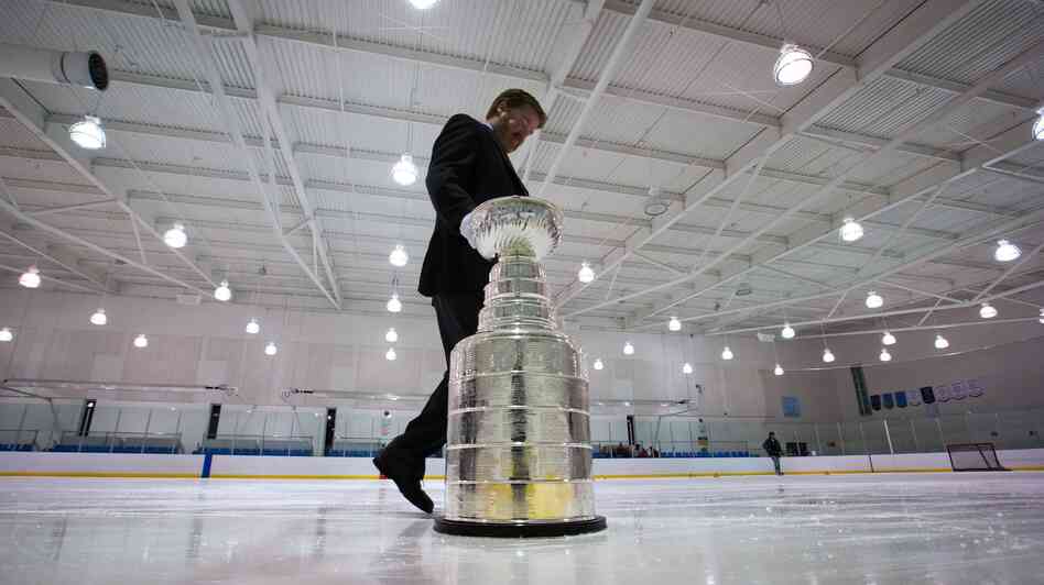 Mike Bolt, keeper of the Stanley Cup, takes it off the ice on Dec. 7, 2012, in Vancouver, British Columbia. The NHL lockout enters its 88th day on Wednesday.