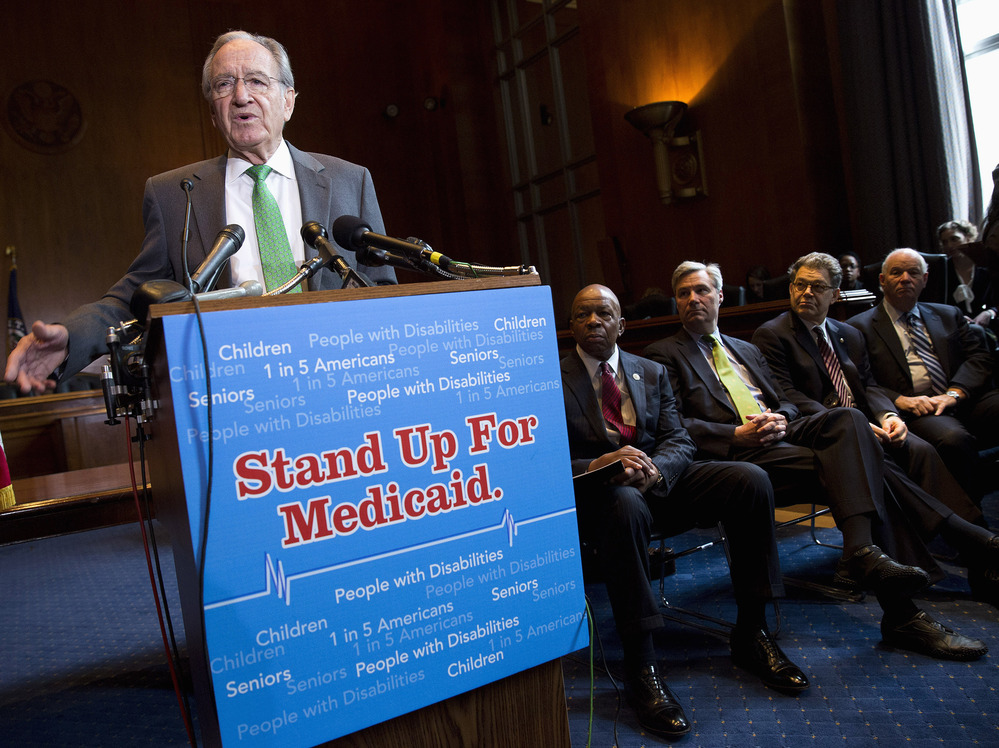 Sen. Tom Harkin, D-Iowa, speaks Tuesday as Rep. Elijah Cummings, D-Md., Sen. Sheldon Whitehouse, D-R.I., Sen. Al Franken, D-Minn., and Sen. Ben Cardin, D-Md., listen during a news conference on Capitol Hill calling for no reduction in the Medicare and Medicaid budgets as part of the year-end budget talks. Sen. Tom Harkin, D-Iowa, speaks Tuesday as Rep. Elijah Cummings, D-Md., Sen. Sheldon Whitehouse, D-R.I., Sen. Al Franken, D-Minn., and Sen. Ben Cardin, D-Md., listen during a news conference on Capitol Hill calling for no reduction in the Medicare and Medicaid budgets as part of the year-end budget talks.