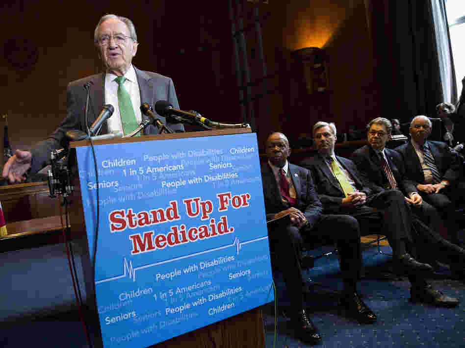 Sen. Tom Harkin, D-Iowa, speaks Tuesday as Rep. Elijah Cummings, D-Md., Sen. Sheldon Whitehouse, D-R.I., Sen. Al Franken, D-Minn., and Sen. Ben Cardin, D-Md., listen during a news conference on Capitol Hill calling for no reduction in the Medicare and Medicaid budgets as part of the year-end budget talks. Sen. Tom Harkin, D-Iowa, speaks Tuesday as Rep. Elijah Cummings, D-Md., Sen. Sheldon Whitehouse, D-R.I., Sen. Al Franken, D-Minn., and Sen. Ben Cardin, D-Md., listen during a news conference on Capitol Hill calling for no reduction in the Medicare and Medicaid budgets as part of the year-end budget talks.