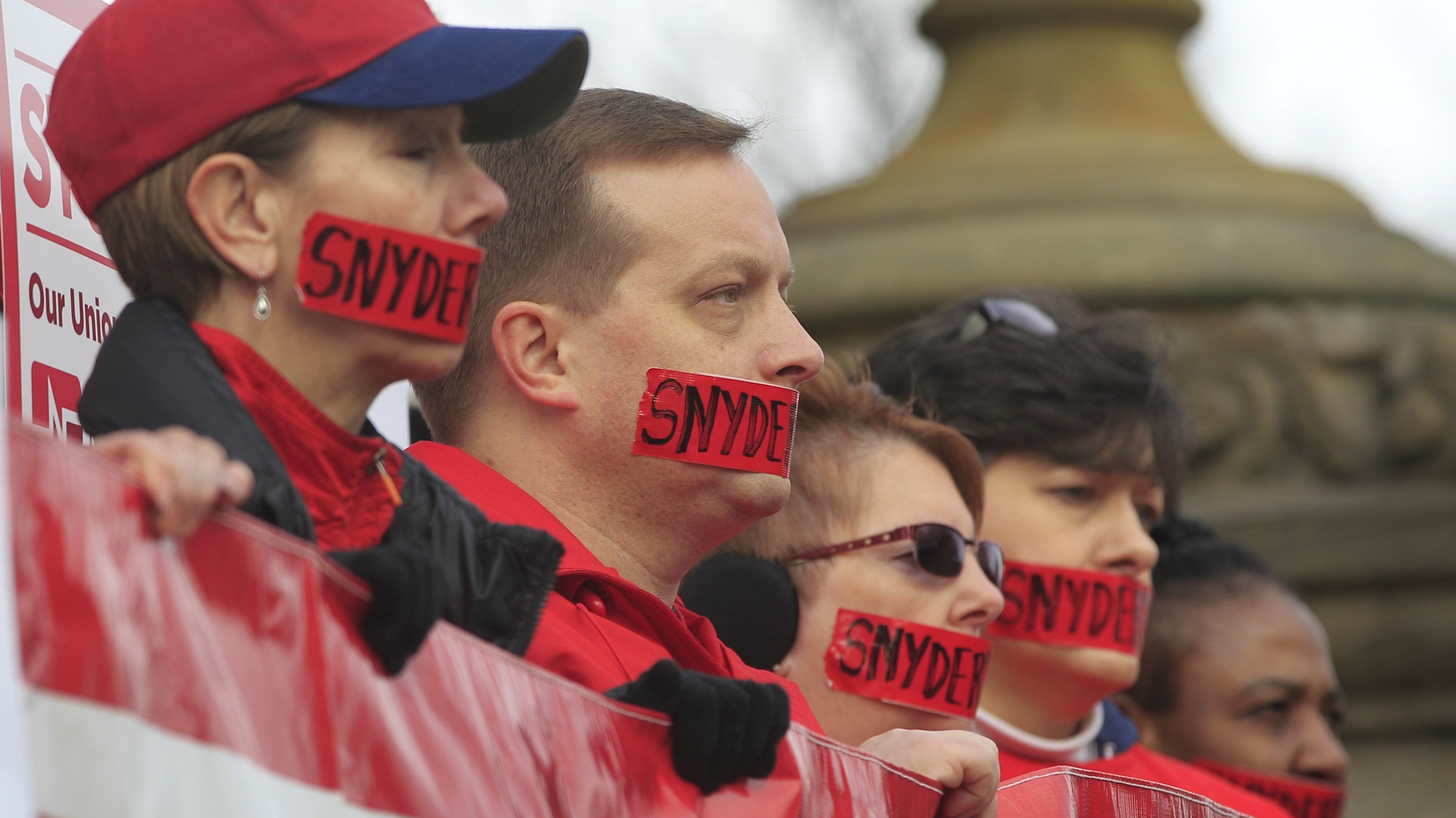 Members of the Michigan Nurses Association state on the Michigan state capitol steps on Dec. 10, 2012, protesting right-to-work legislation backed by lawmakers and Gov. Rick Snyder.