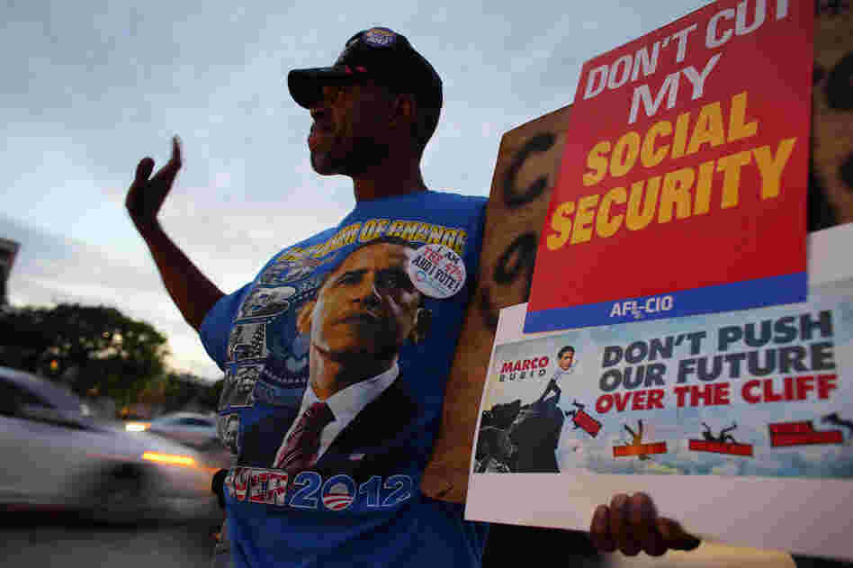 A protester at a fiscal cliff rally on Monday in Doral, Fla. A protester at a fiscal cliff rally on Monday in Doral, Fla.