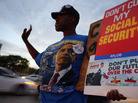 A protester at a fiscal cliff rally on Monday in Doral, Fla. A protester at a fiscal cliff rally on Monday in Doral, Fla.