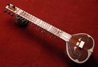Traditional Indian string instrument, wood and ivory inlay. Traditional Indian string instrument, wood and ivory inlay.