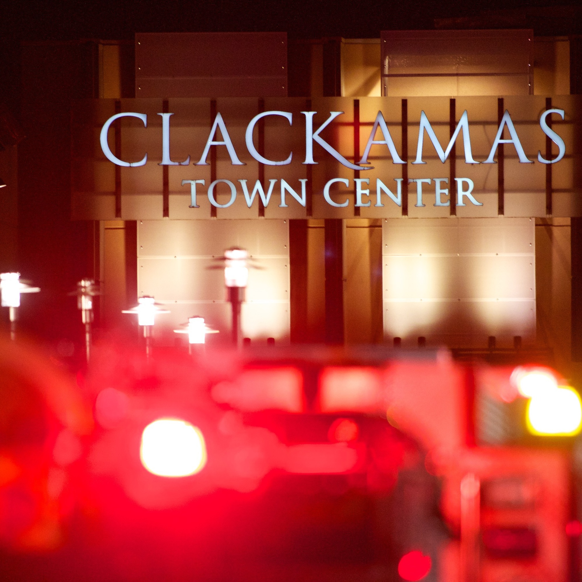 The lights of emergency vehicles illuminated the night Tuesday at the Clackamas Town Center mall just outside Portland.
