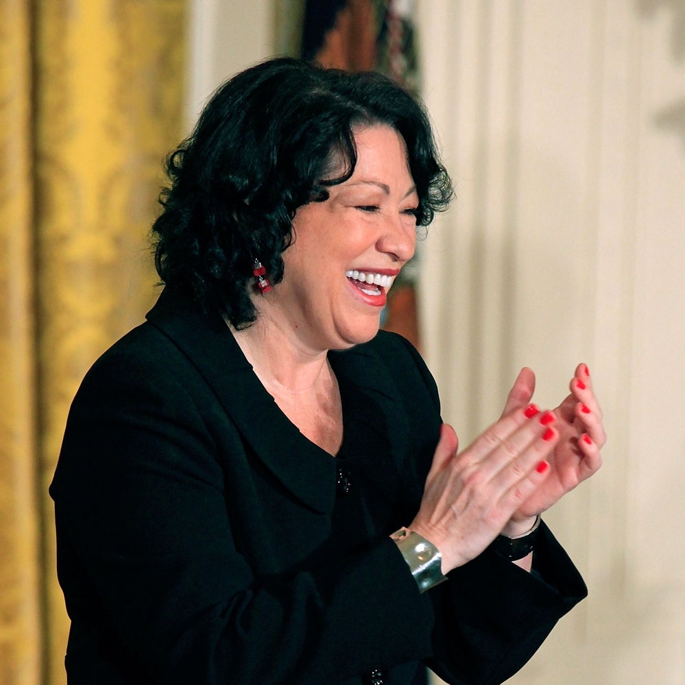 Supreme Court Associate Justice Sonia Sotomayor applauds during a reception in her honor at the White House.