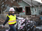 A woman with the Army Corps of Engineers documents a destroyed home last month in a residential area of New Dorp Beach on Staten Island in New York City. A woman with the Army Corps of Engineers documents a destroyed home last month in a residential area of New Dorp Beach on Staten Island in New York City.