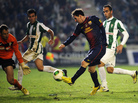 Barcelona forward Lionel Messi (in dark blue) shoots on Cordoba's goalkeeper Mikel Saizar (left) during the Spanish Copa del Rey football match in Cordoba on Wednesday. Barcelona forward Lionel Messi (in dark blue) shoots on Cordoba's goalkeeper Mikel Saizar (left) during the Spanish Copa del Rey football match in Cordoba on Wednesday.