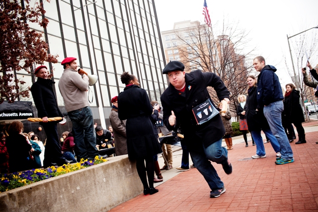 Still chewing his last pastry, Bowers takes off running the first leg of the relay race around NPR Headquarters in DC.