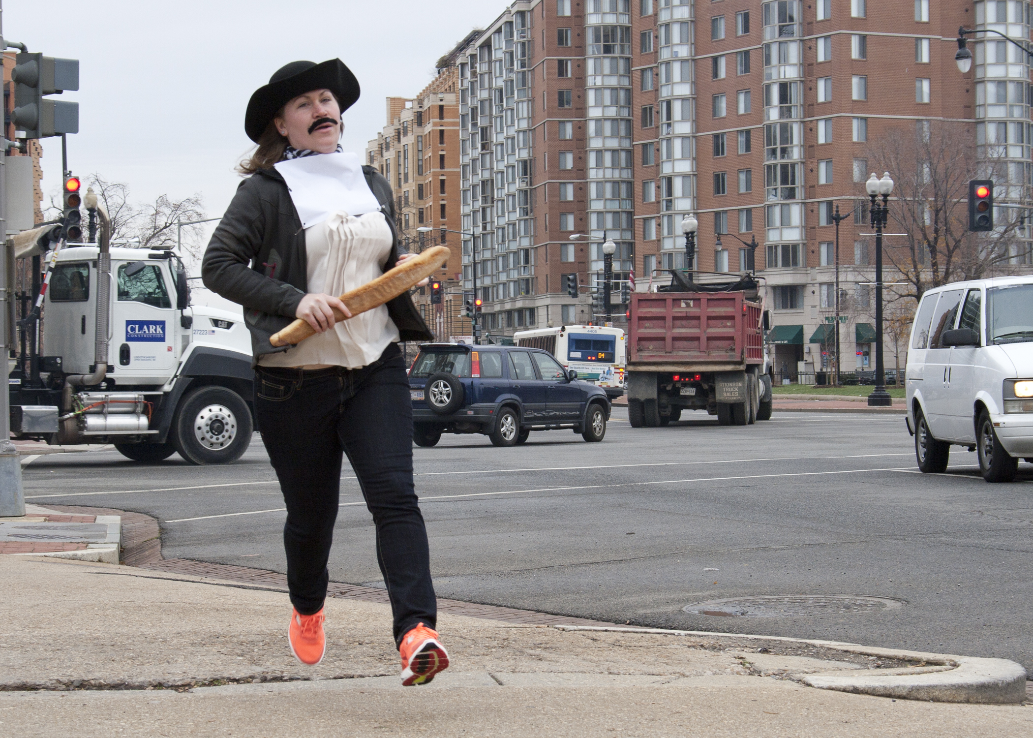Mariah Dodson (Office of the General Counsel) rounds the corner along Massachusetts Avenue to reach the final challenge of the race.