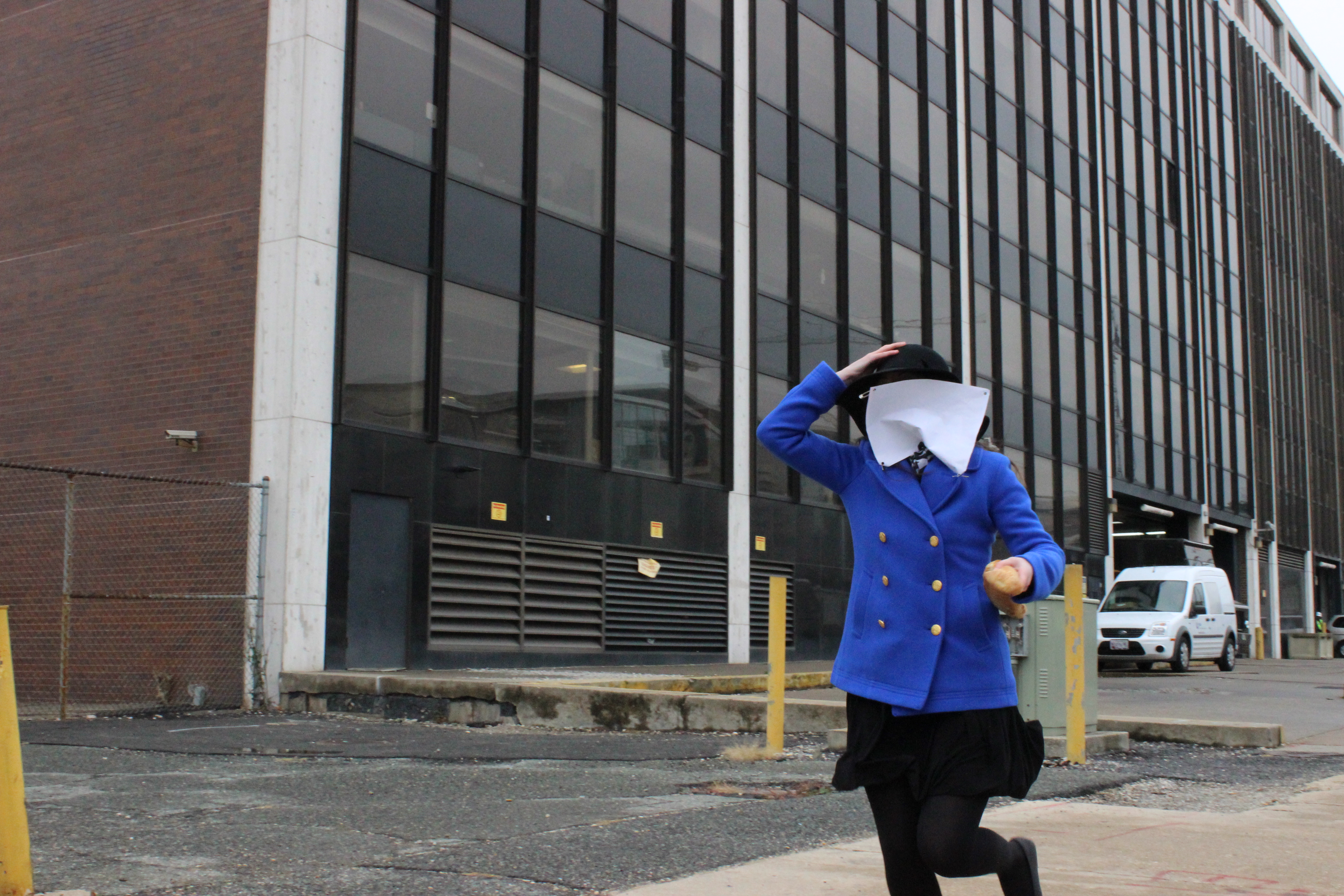 Taylor Phares, a paralegal in the Office of the General Counsel, keeps the pace as her runner's bib flies up in her face near the third relay stop.