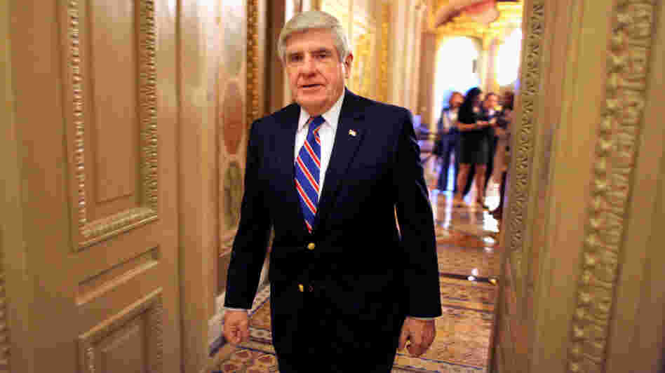 Sen. Ben Nelson, D-Neb., walks off the Senate floor in 2011.