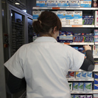 An employee tidies boxes of medicines displayed in a pharmacy in the city of Caen in western France last month. Beginning in 2013, girls between the ages of 15 and 18 will be able to get birth control free of charge, and without parental notification.