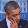 President Obama wipes his eye as he speaks during a press conference at the White House following the shooting in a Connecticut elementary school that left several dead, including children.