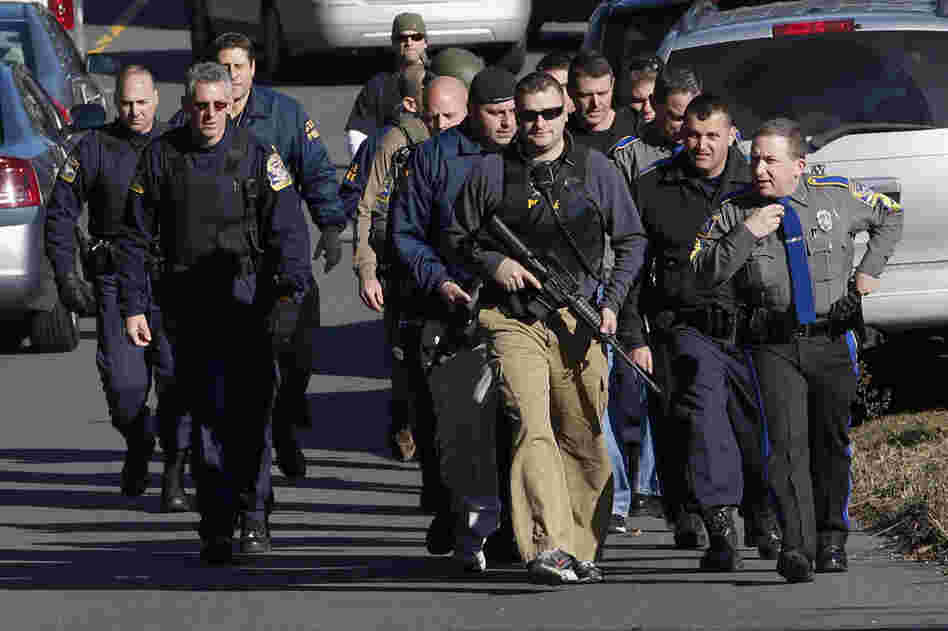 Police patrol the streets outside the school.