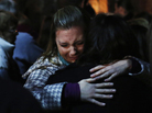 People grieve outside the overflow area of a vigil at the Saint Rose of Lima church in Newtown, Conn., on Friday following the mass shooting at the Sandy Hook Elementary School. People grieve outside the overflow area of a vigil at the Saint Rose of Lima church in Newtown, Conn., on Friday following the mass shooting at the Sandy Hook Elementary School.