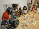 Kids build robots with Popsicle sticks at an Oakland meeting of Hacker Scouts, a group that encourages young people to create do-it-yourself crafts and electronics. Kids build robots with Popsicle sticks at an Oakland meeting of Hacker Scouts, a group that encourages young people to create do-it-yourself crafts and electronics.