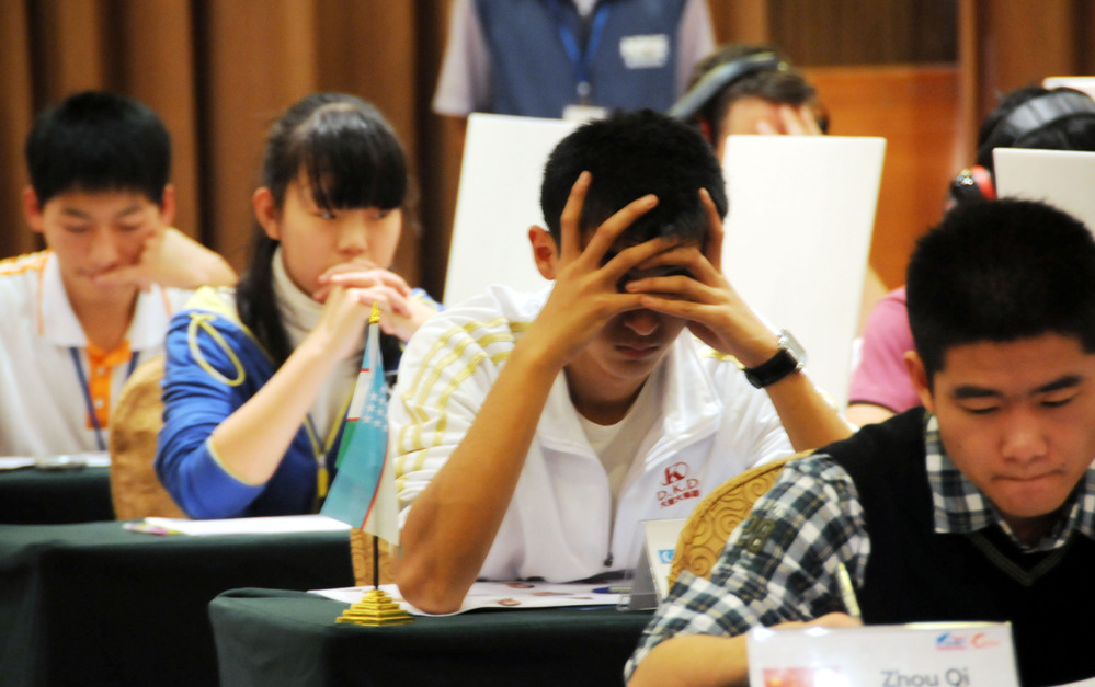 Argh, it's on the tip of my tongue! Contestants in the Names and Faces competition focus at last year's World Memory Championships held in Guangzhou, China. A new field of mental athletes is currently vying for the 2012 championship.