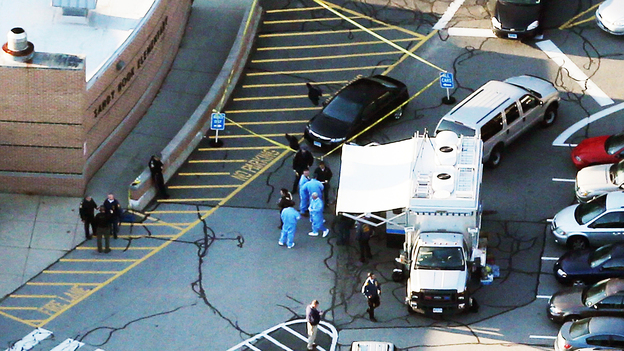 Police and medical staff work outside Sandy Hook Elementary School in Newtown, Conn., where 27 people — 20 of them children — were killed Friday morning. Police have not officially declared a suspect, but news accounts have named Adam Lanza, 20, as the suspected gunman.