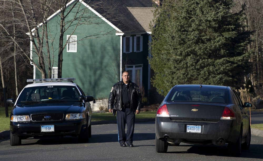 Police block a road near the house of Nancy Lanza in Newtown, Conn., on Saturday. Authorities say Lanza's son Adam killed her before opening fire at Sandy Hook Elementary School on Friday. Police block a road near the house of Nancy Lanza in Newtown, Conn., on Saturday. Authorities say Lanza's son Adam killed her before opening fire at Sandy Hook Elementary School on Friday.